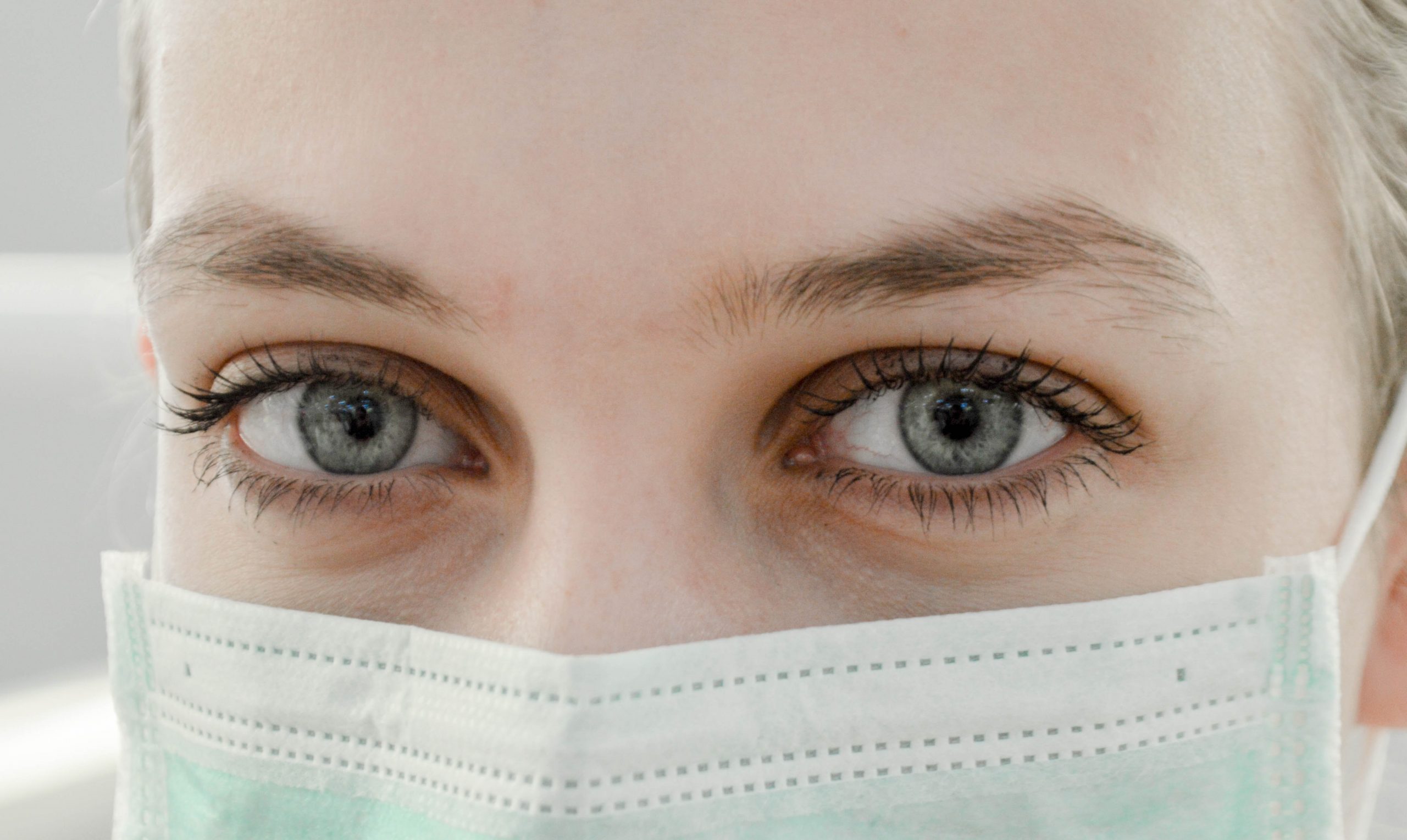 Woman wearing mask. Eyes.